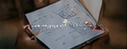 Reviewing sales numbers on a laptop